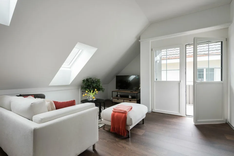 Modern attic apartment with new building character