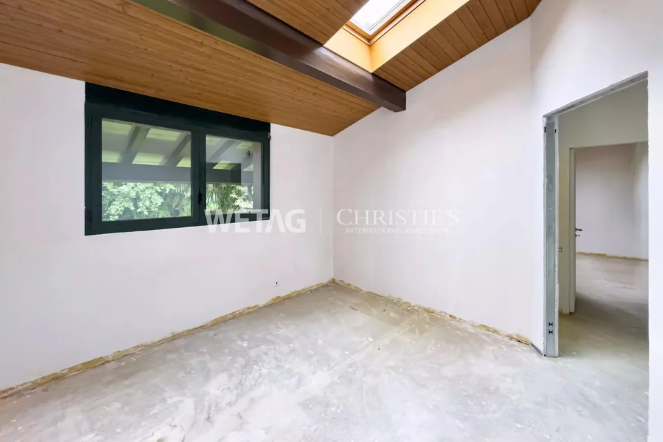 Lugano-Gentilino : appartement élégant au dernier étage avec vue sur le lac, rénové dans l'état brut et à vendre dans un environnement verdoyant – photo 11 sur 13