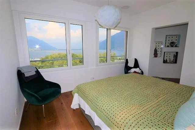 Appartamento 4,5 locali con ampia terrazza, giardino e vista lago – Foto 16 von 36