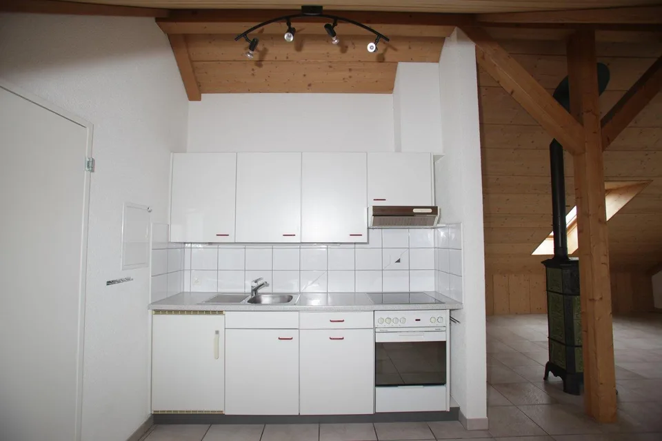 1.5-Zimmer-Dachwohnung mit Kaminofen und traumhafter Bergsicht