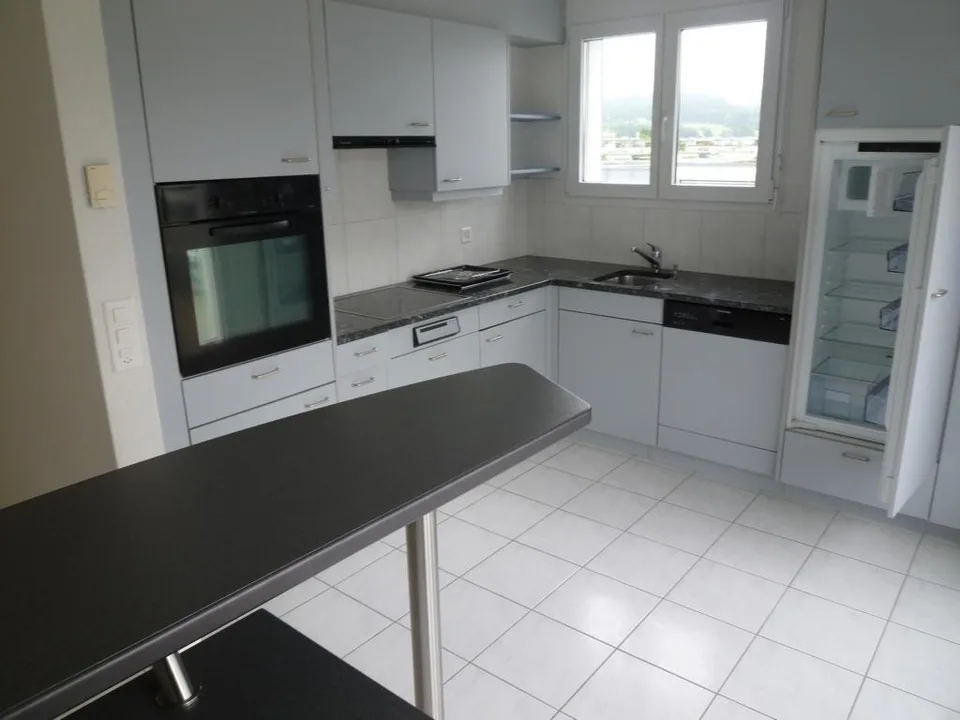 Appartamento moderno in mansarda di 5.5 locali con balcone vetrato & terrazza