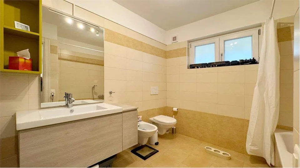 Appartamento in vendita da 2.5 locali con giardino privato – foto 8 di 8