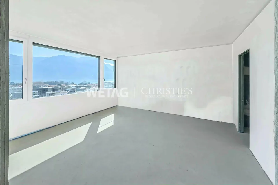 Un penthouse moderno, in costruzione, con vista sulla città e sul lago, è in vendita a Lugano