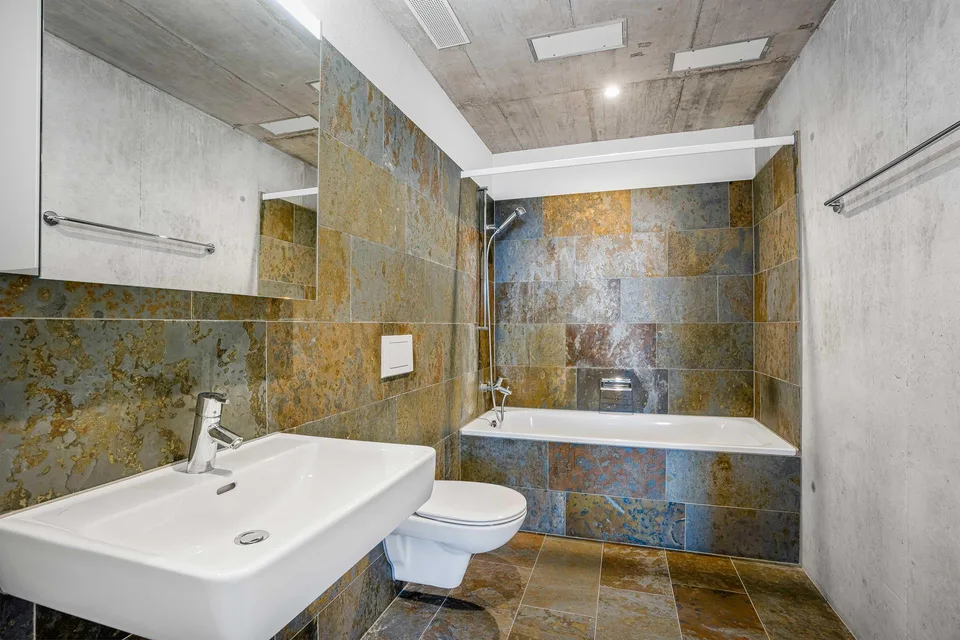 Appartement lumineux 2.5 pièces avec cuisine moderne et espace de séjour privé