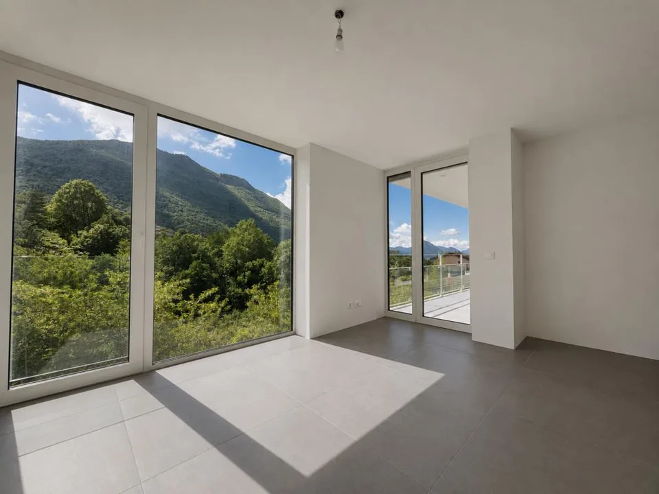 Appartamento con terrazza e splendida vista su Lugano e le montagne