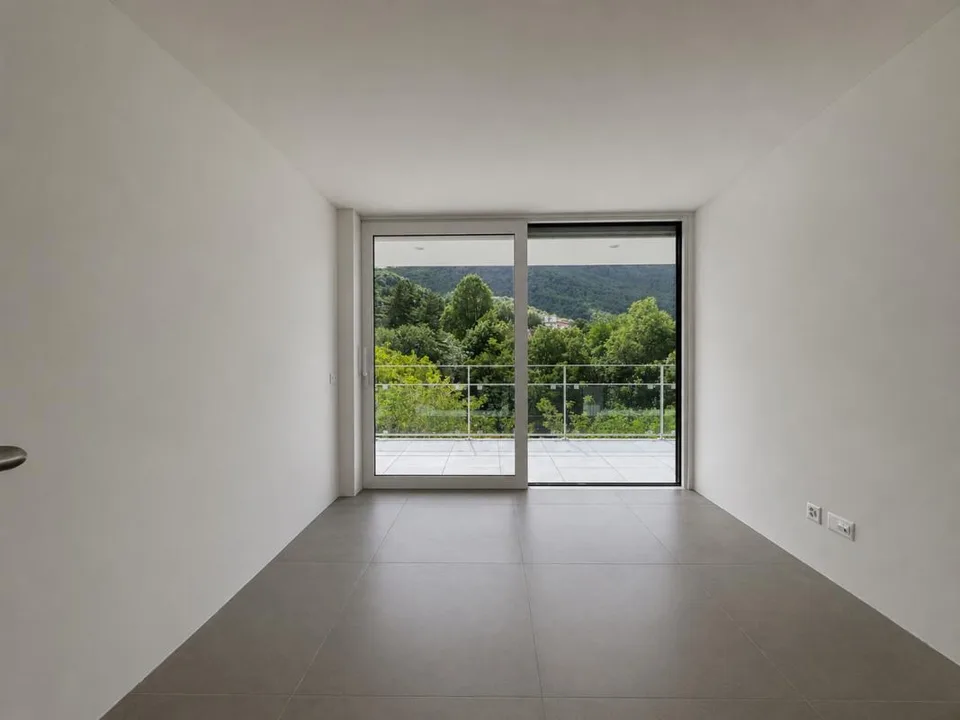 Appartamento con terrazza e splendida vista su Lugano e le montagne
