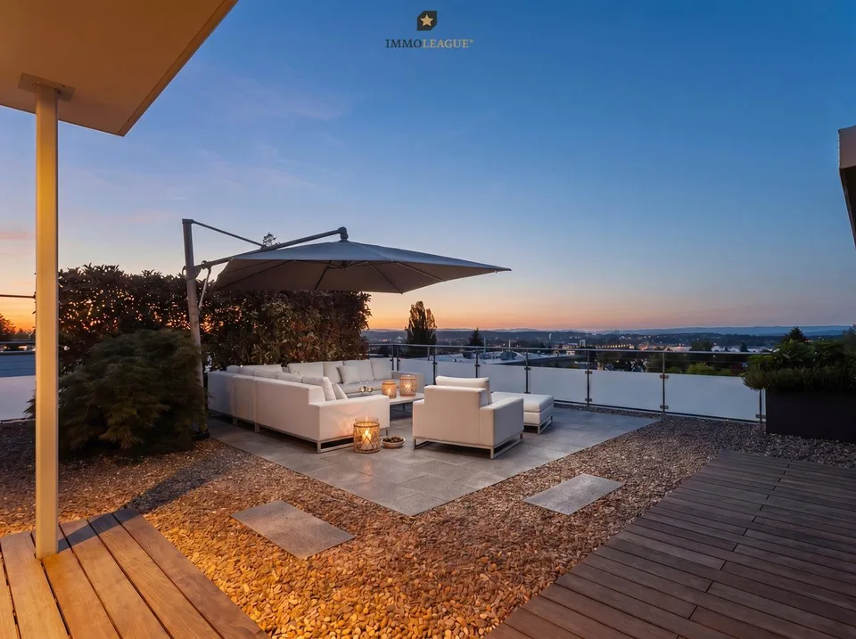 Exclusive attic maisonette with pool, whirlpool, sauna, and lake view.
