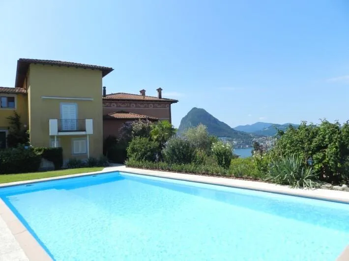 Lugano-Ruvigliana: elegant apartment with breathtaking lake view, pool & garden for sale