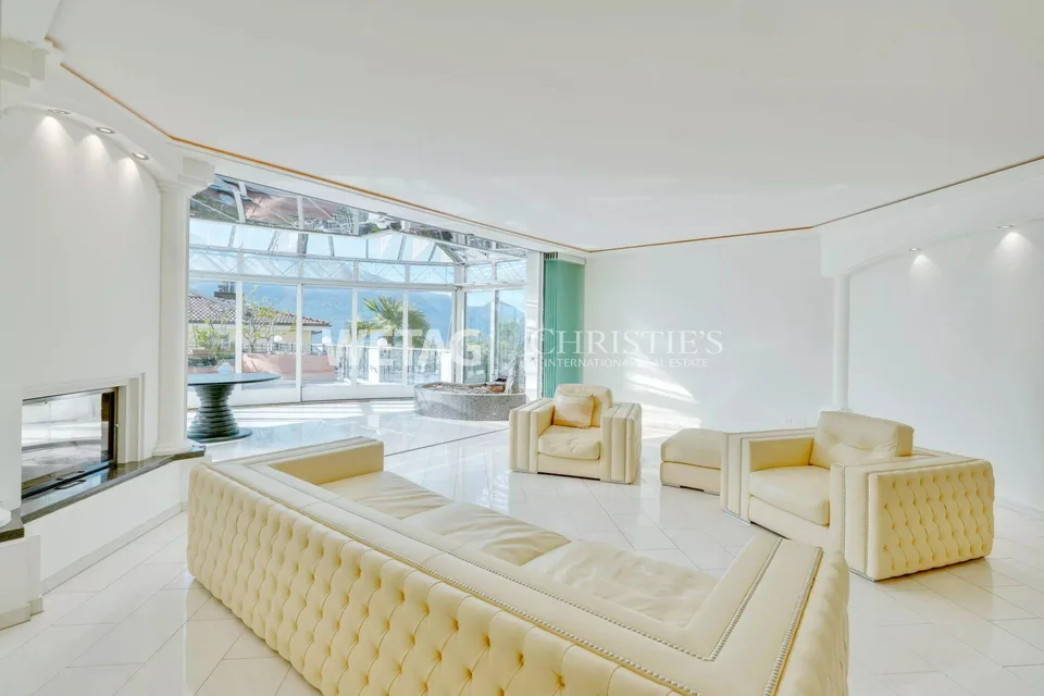 Muralto: Modern, bright apartment with large terrace & elegant glass architecture for sale