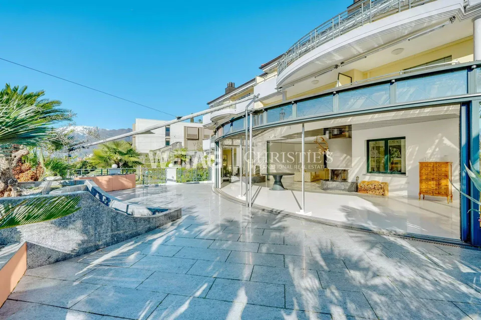 Muralto: Modern, bright apartment with large terrace & elegant glass architecture for sale