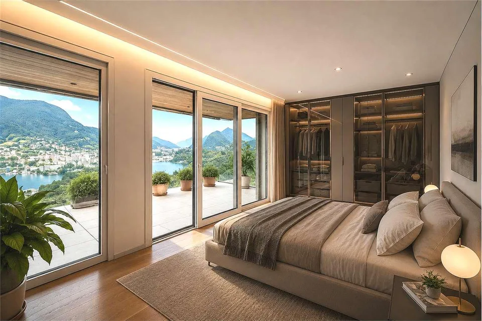 Attico panoramico con ampia terrazza e vista lago