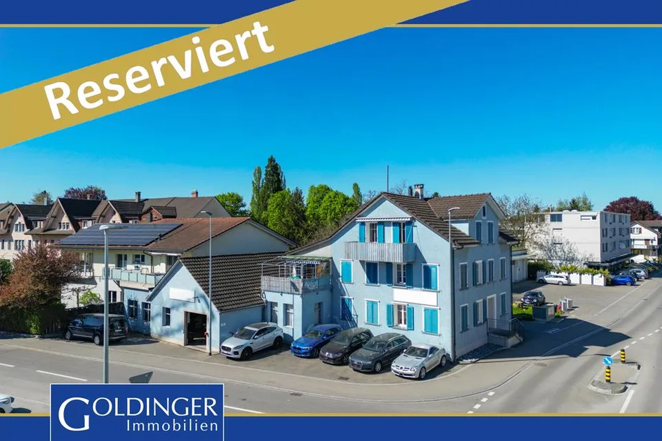 Mehrfamilienhaus mit Autowerkstatt an zentraler Lage
