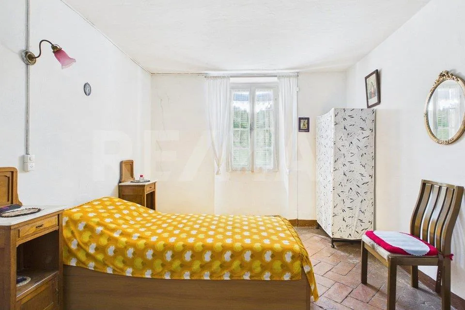 Casa da ristrutturare a Caneggio: ottima opportunità d'investimento – Foto 11 von 13
