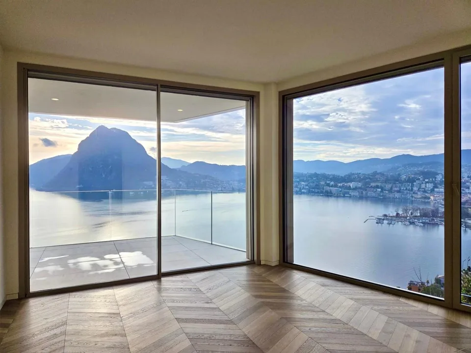 ATTICO DI ALTO STANDING CON VISTA ECCEZIONALE SUL LAGO DI LUGANO
