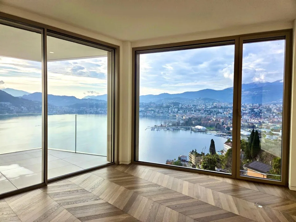 ATTICO DI ALTO STANDING CON VISTA ECCEZIONALE SUL LAGO DI LUGANO