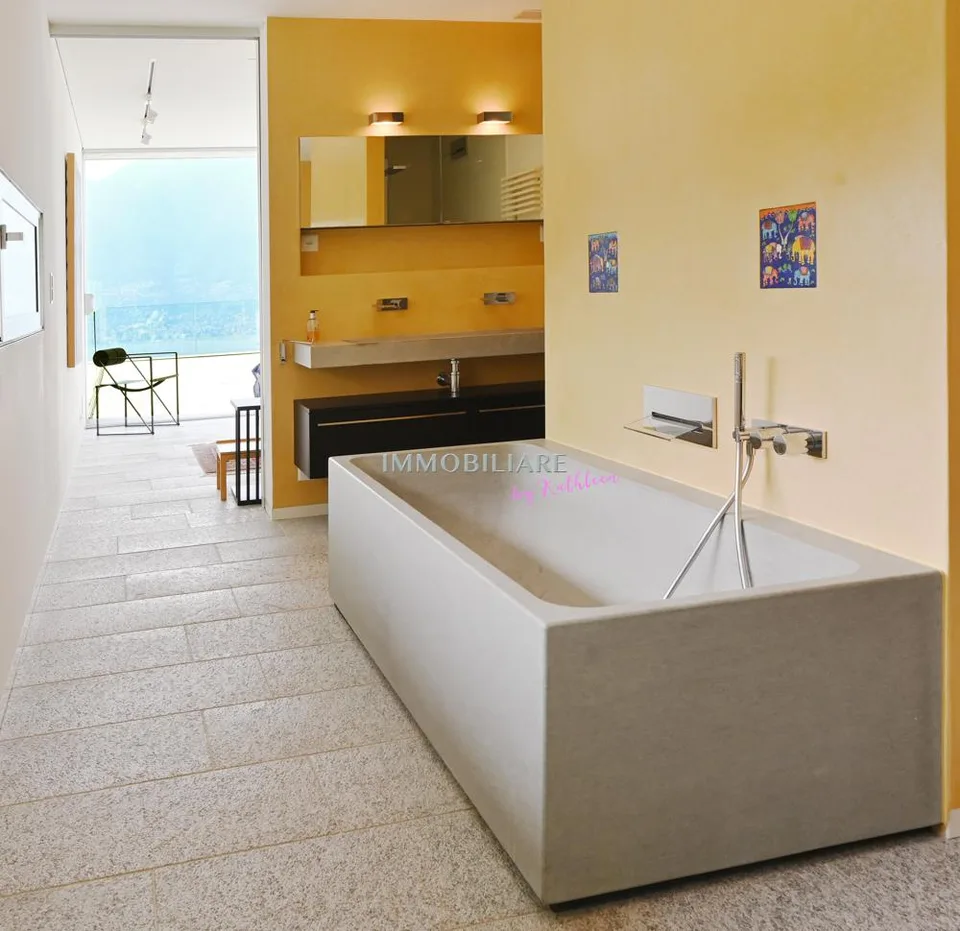 Villa mit Sichtbeton, Panoramaseeblick und nachhaltiger Ausstattung – Foto 9 von 16