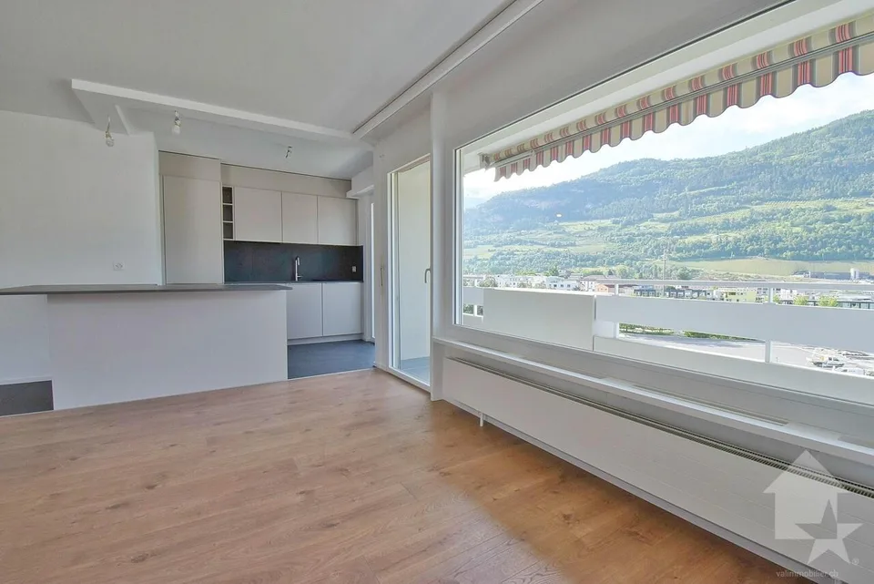 4.5 pièces avec une magnifique vue et 1 place de parc intérieure