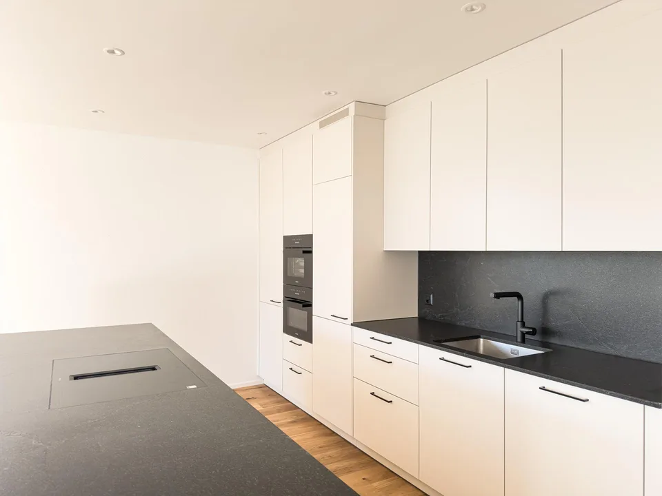 5.5 Neubauwohnung mit Weitsicht in Einfamilienhausquartier