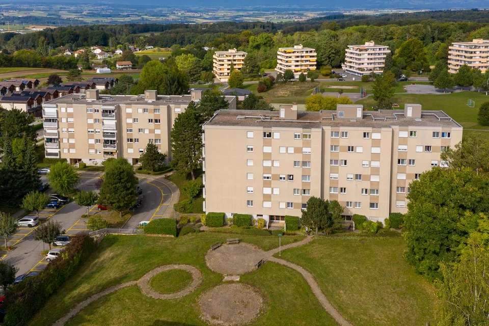 Place de parc à Romanel - Parking intérieur