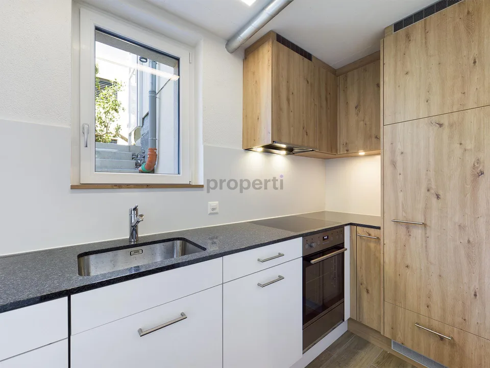 Charmant appartement 2.5 pièces dans un quartier calme de maisons unifamiliales