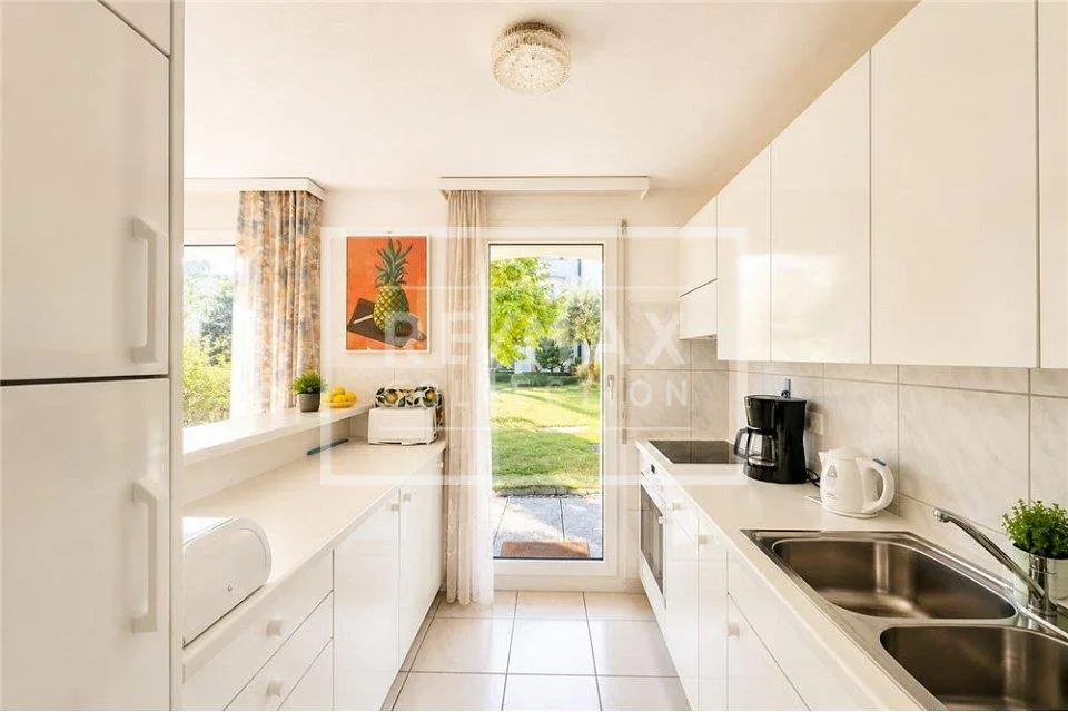 ASCONA appartamento di 3.5 locali con giardino e piscina / residenza secondaria