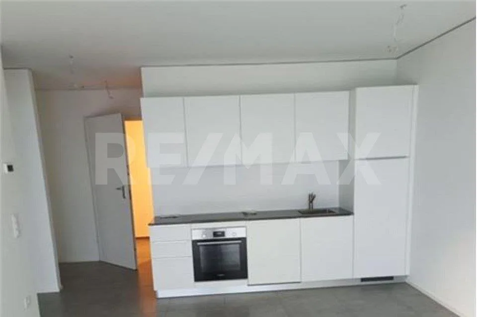 Appartement moderne 2,5 pièces avec jardin et parking