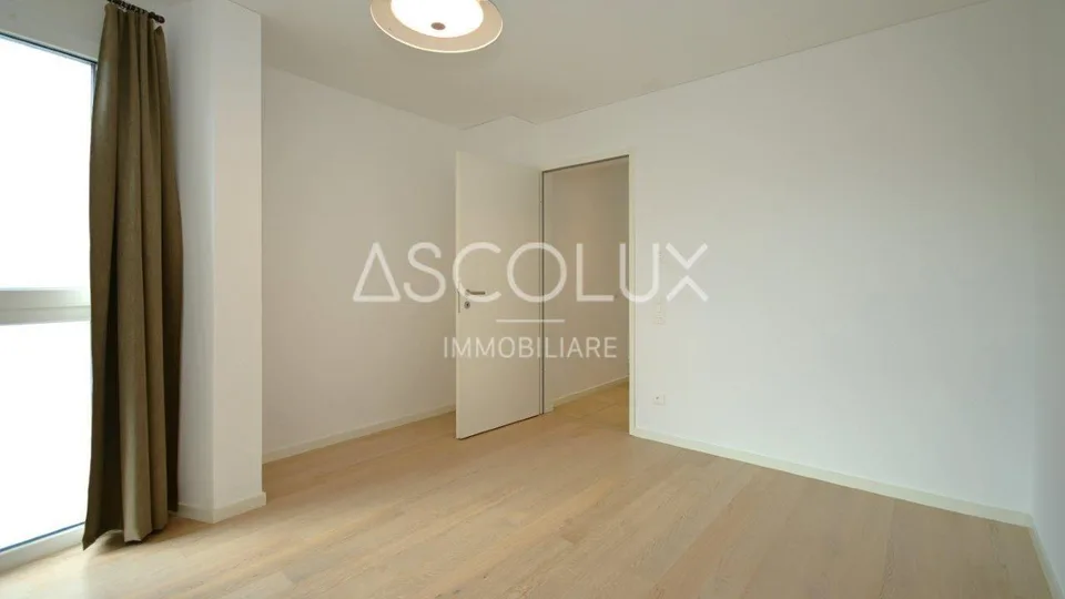 Appartamento 3.5 locali con terrazza coperta, vista panoramica e lago – foto 17 di 30