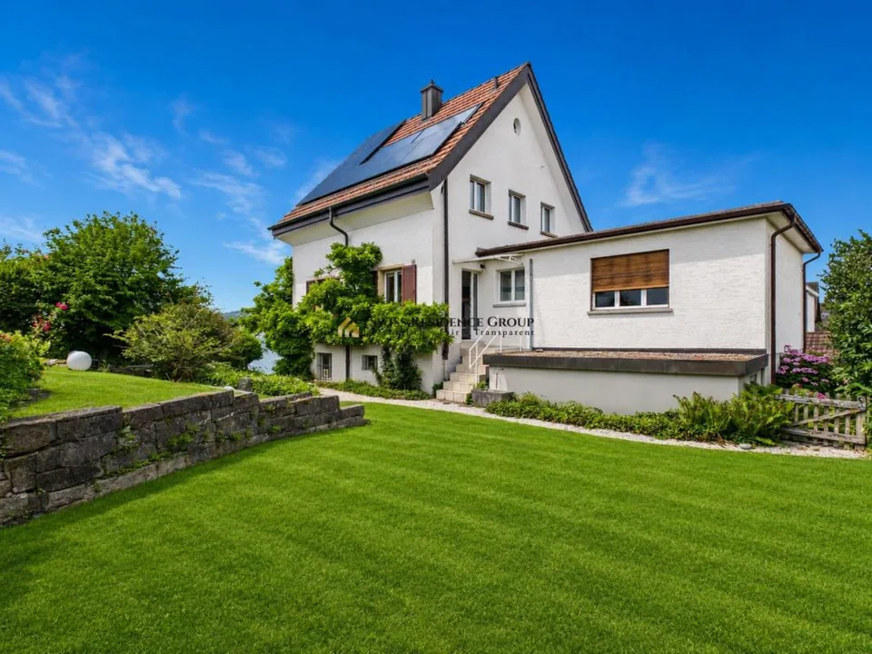 Casa unifamiliare affascinante con terrazze giardino e vista mozzafiato sul lago