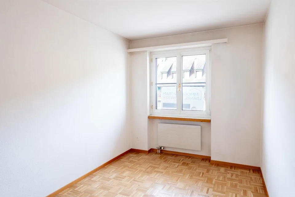 Condominium bien entretenu avec balcon, cave et trois boxes de garage – photo 11 sur 15