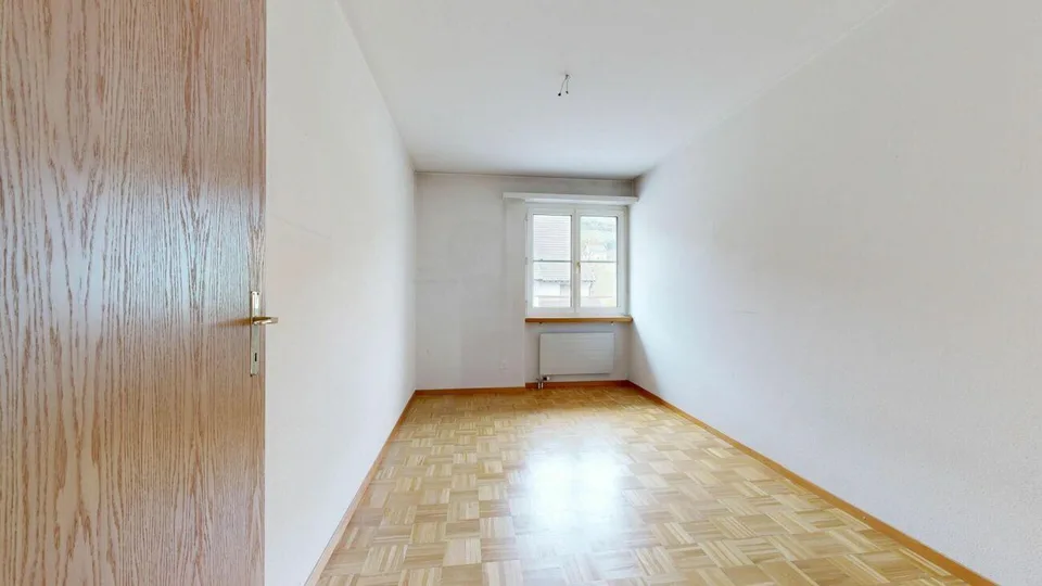 Condominium bien entretenu avec balcon, cave et trois boxes de garage – photo 12 sur 15