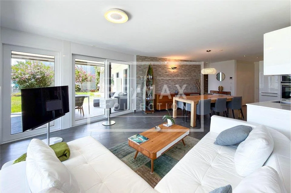 Appartamento 3.5 locali con giardino e vista lago