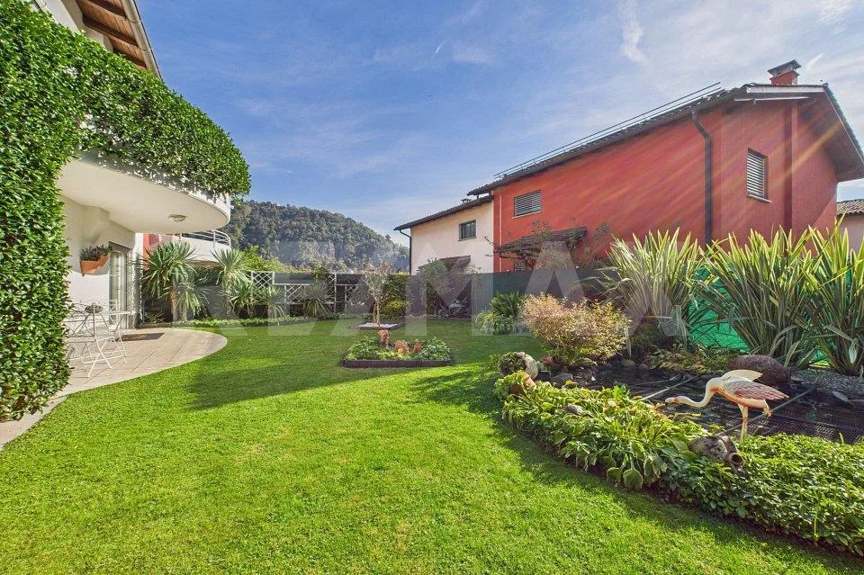 Elegante casa gemella con giardino incantevole a Bedano – Foto 12 von 13