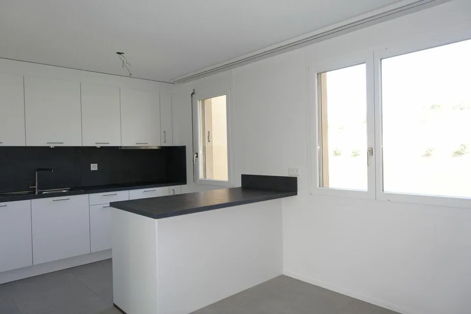 Renovierte 3.5 Zi-Eigentumswohnung mit Balkon und Einstellhallenplatz