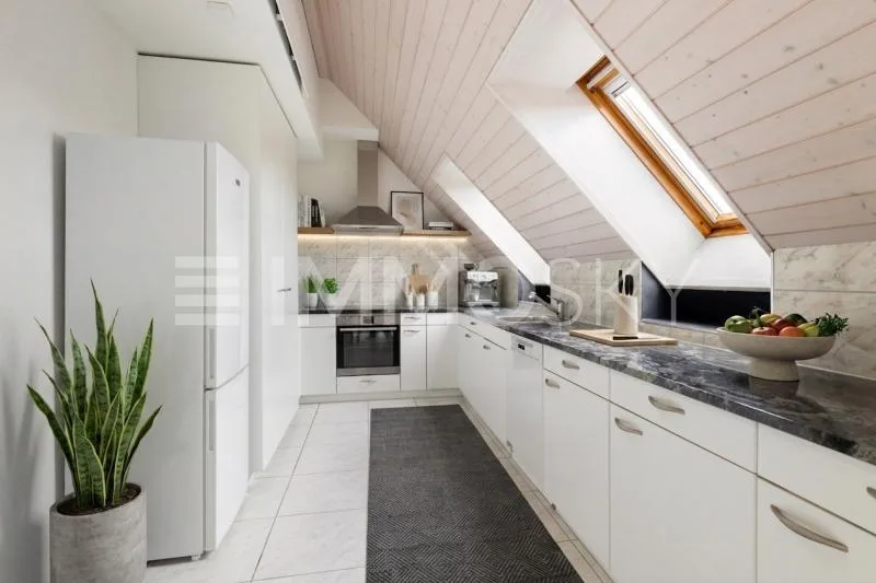Two attic residences with private lift directly in front of the door