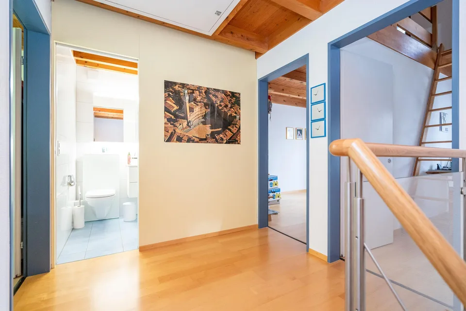 5.5-room row house with outdoor seating areas, two balconies, and a parking space