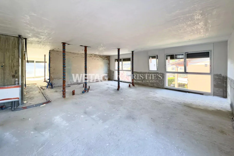 Penthouse élégant en construction brute à Lugano-Canobbio à vendre, avec terrasse panoramique & vue sur le lac de Lugano