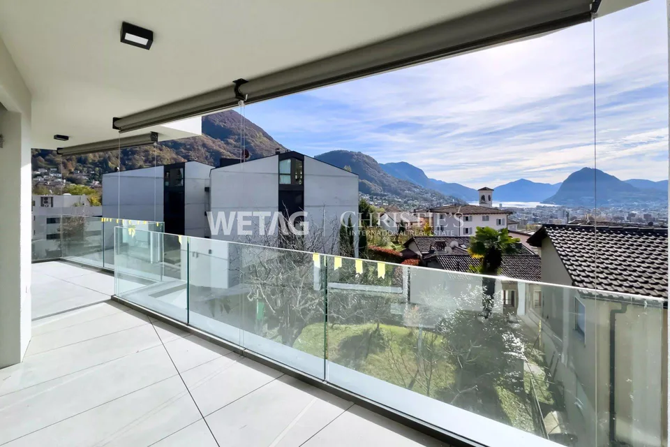 Penthouse élégant en construction brute à Lugano-Canobbio à vendre, avec terrasse panoramique & vue sur le lac de Lugano