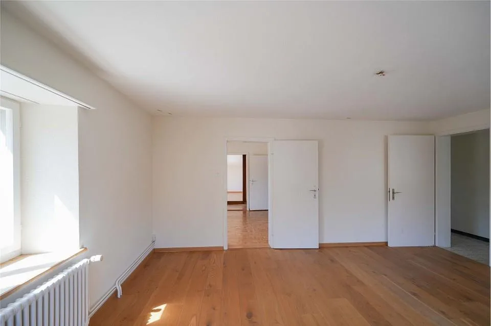 Tax-friendly living near the Rhine: Two-family house with development potential