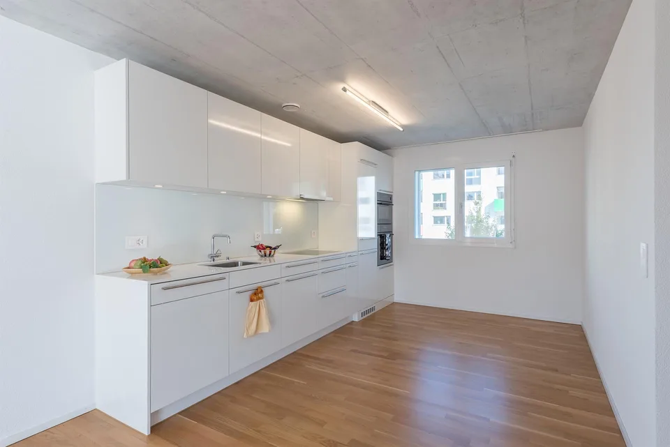 Living space with open kitchen seeks new stories!