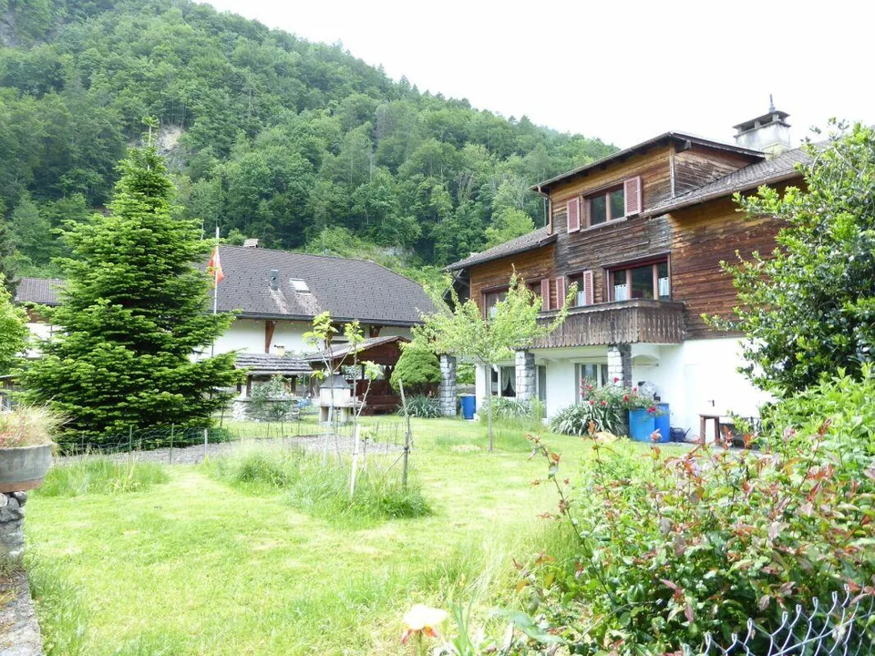 Detached two-family house with garages and spacious surroundings