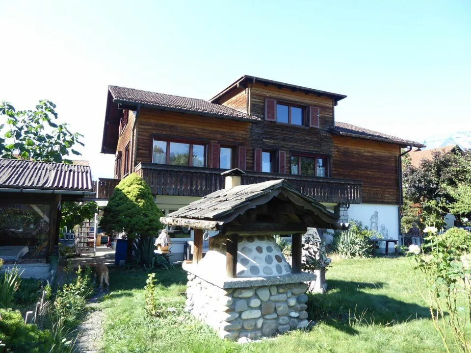 Detached two-family house with garages and spacious surroundings