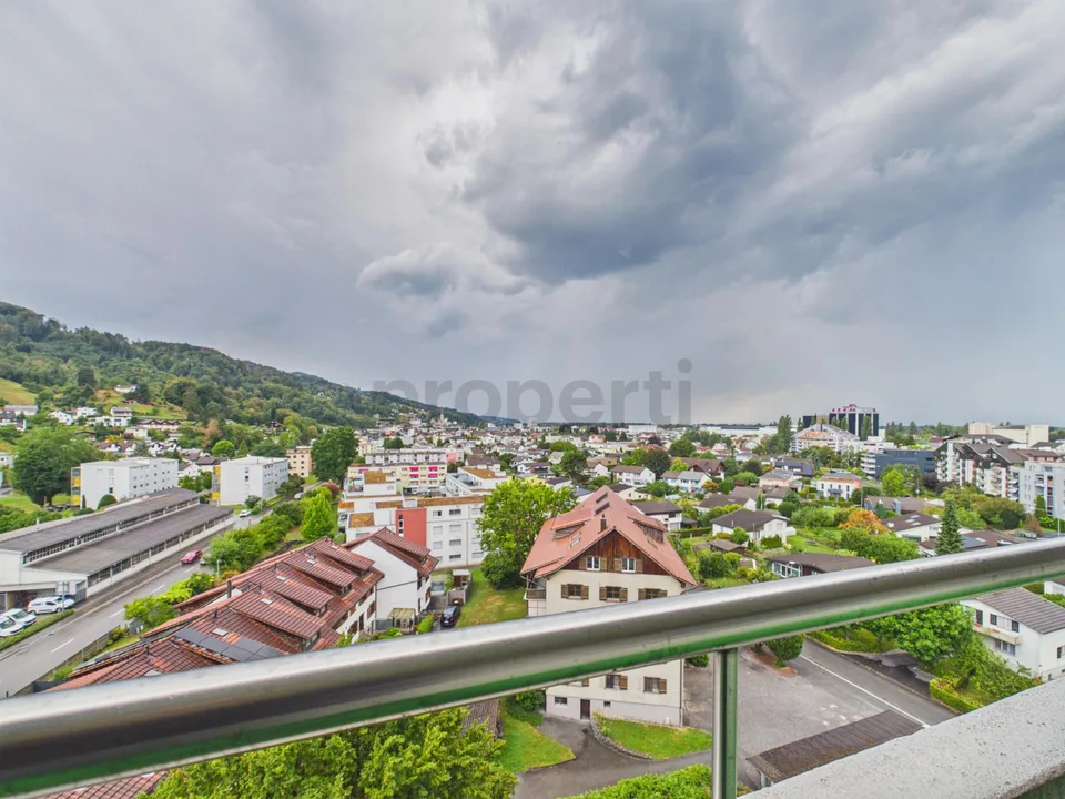Light-filled living with balcony and far-reaching views