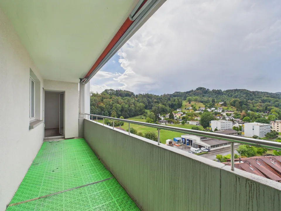 Light-filled living with balcony and far-reaching views