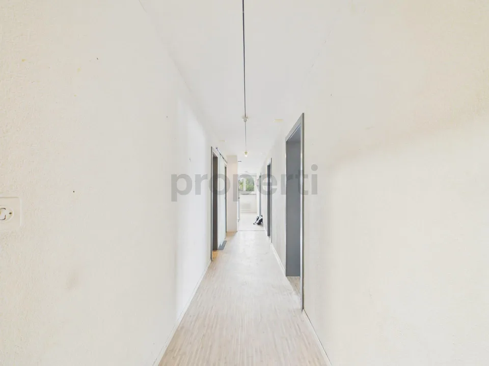 Light-filled living with balcony and far-reaching views