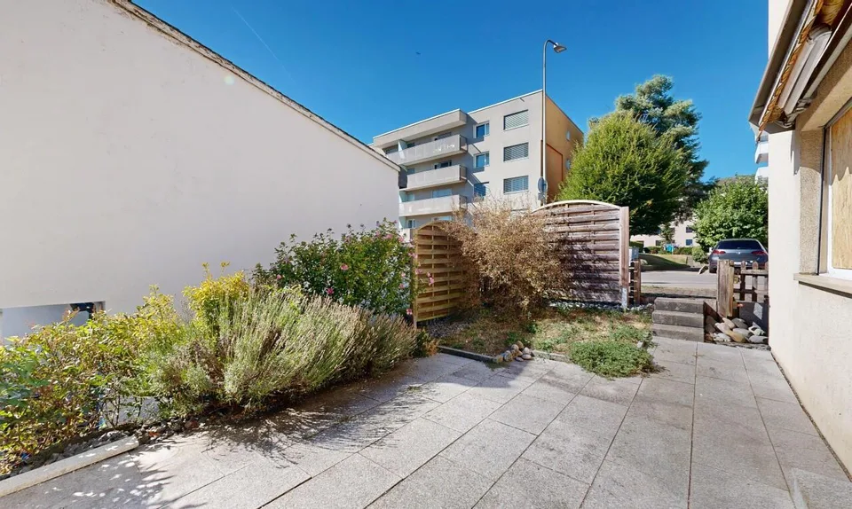 Appartement douillet avec jardin, garage et deux places de parking extérieures – photo 10 sur 11