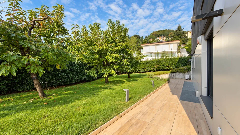 Elegante e prestigioso appartamento con giardino a Porza – photo 14 sur 27