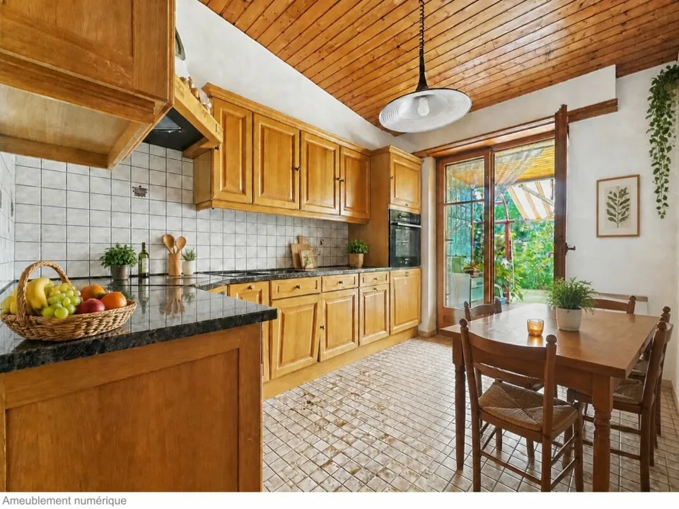 Single-family house on one level on the edge of an agricultural area with a stream