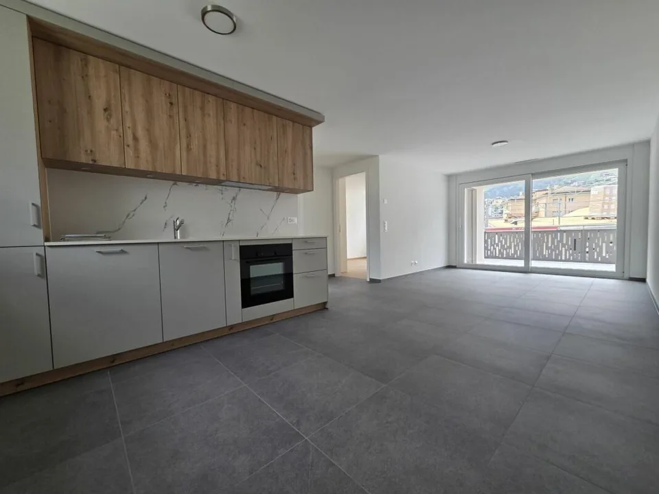 Neuf - Appartement de 3.5 pièces avec balcon et places de parc