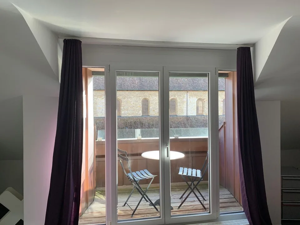 In the center with balcony and view of the old town