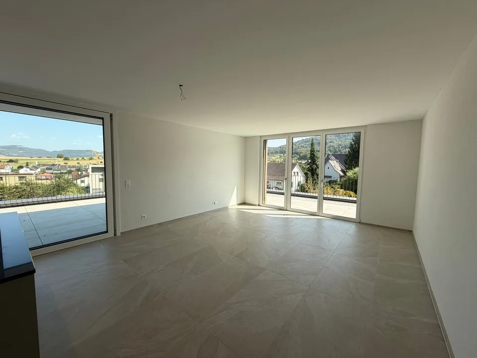 Appartamento mansardato moderno 2.5 locali in un edificio nuovo con una terrazza spaziosa